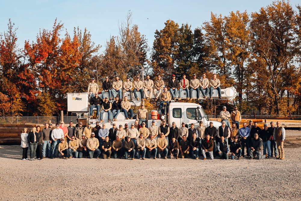 Craig head-Group photo in front of a bucket truck